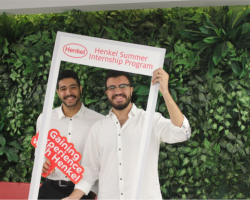 Two Henkel employees having fun at an event.