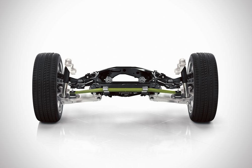 The rear axle of the new Volvo XC90 features a new transverse leaf spring, made of lightweight composite material. 