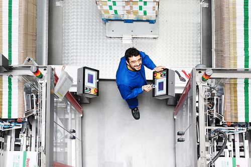 Employee at a packaging machine in a detergent filling facility in Duesseldorf.
